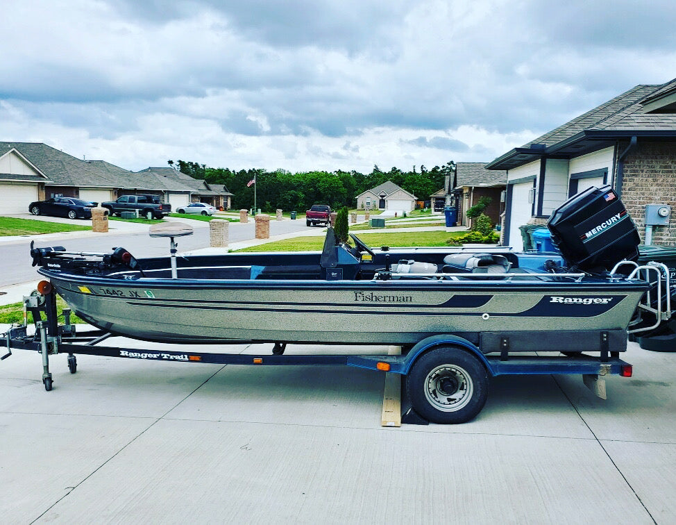 Alternate side-profile photo of the 1990 Ranger Fisherman with Mercury 115 HP motor on its trailer.
