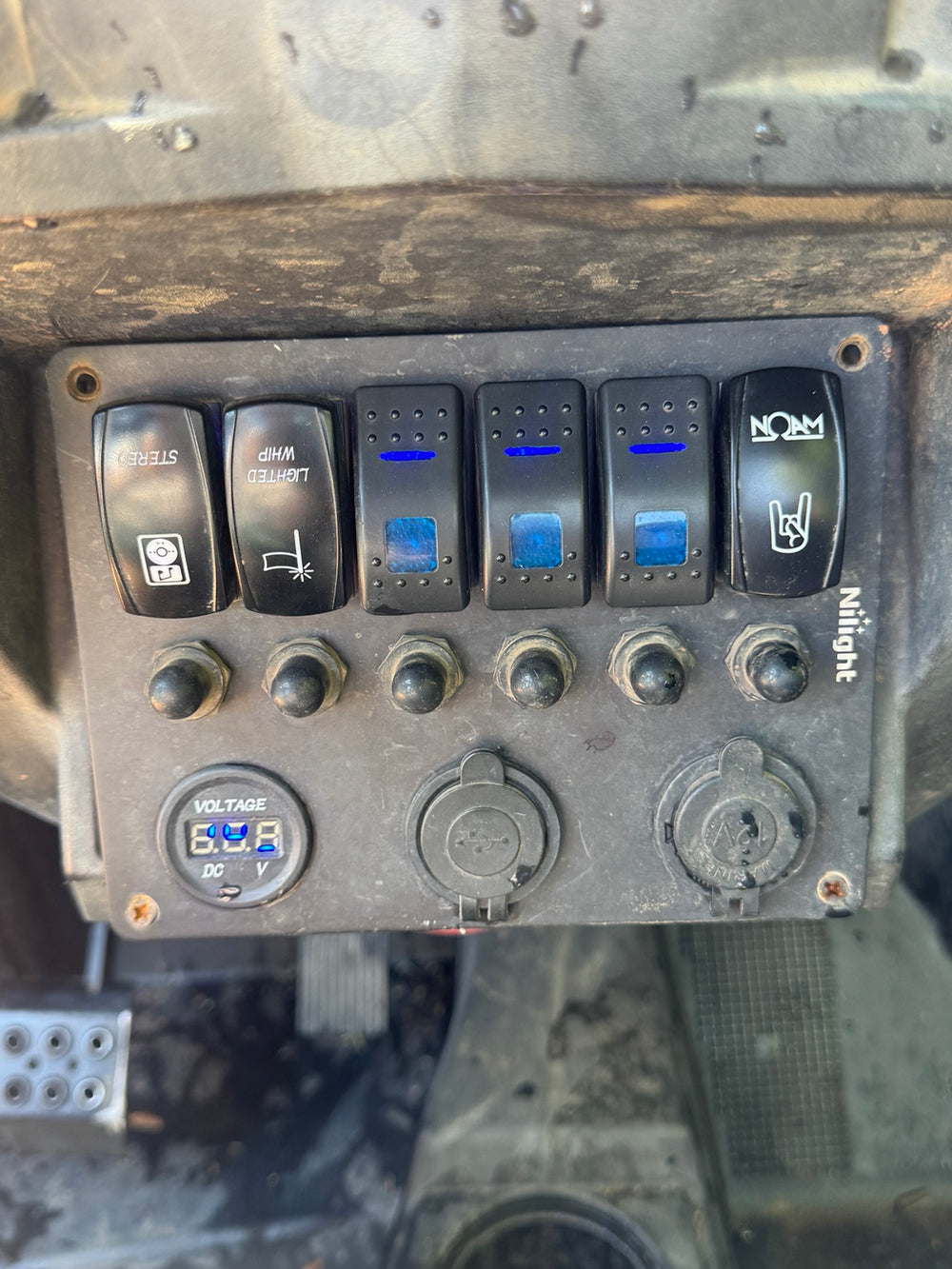 Accessory switch panel, USB port, power socket and voltage display in the 2018 Polaris RZR XP 1000 High Lifter.