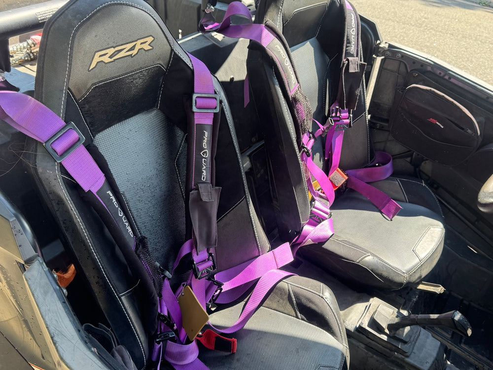 RZR bucket seats with purple Pro Guard harnesses in the 2018 Polaris RZR XP 1000 High Lifter.
